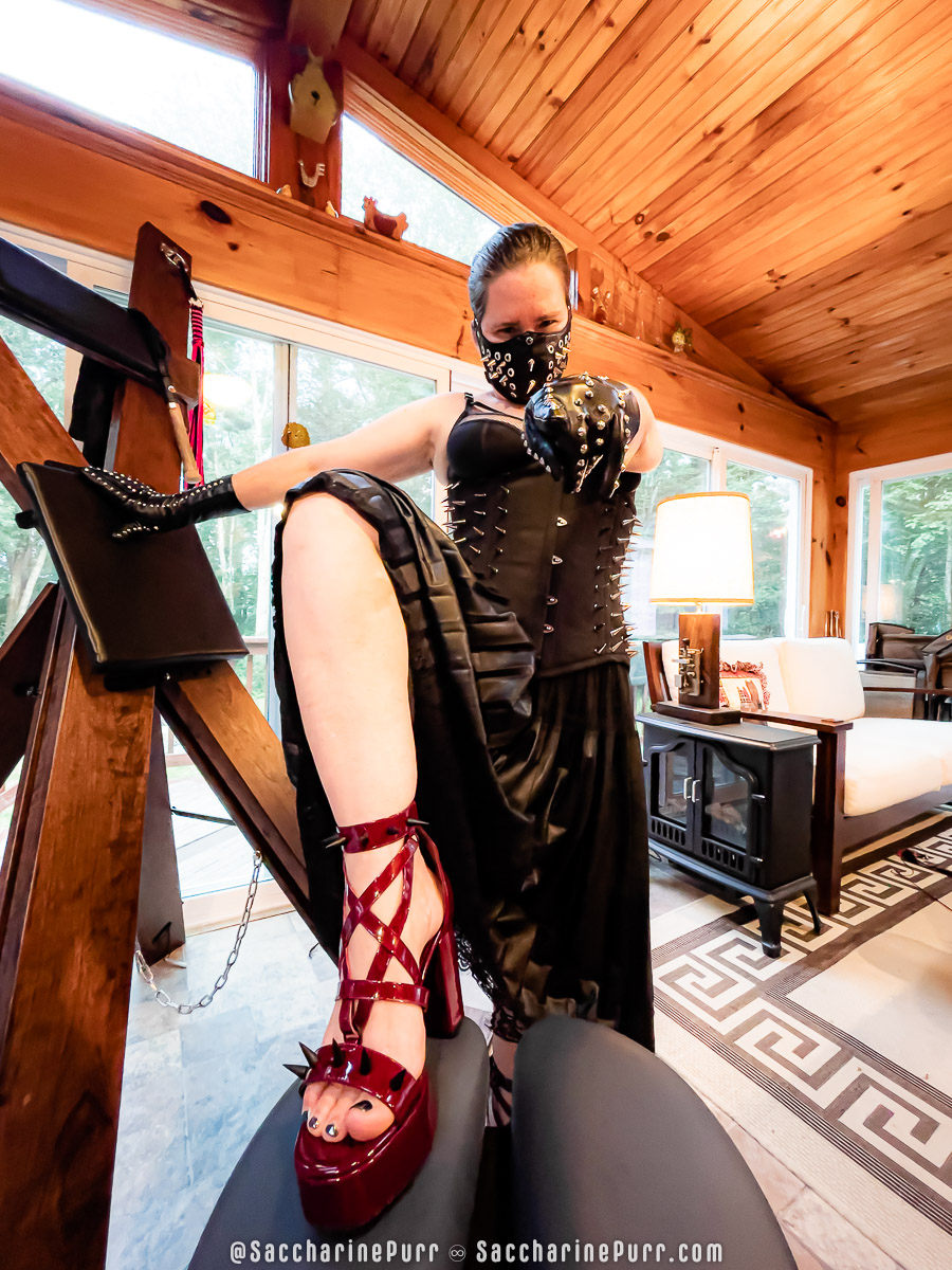 Saccharine Purr Models Her Spiked Mask on The Deck
